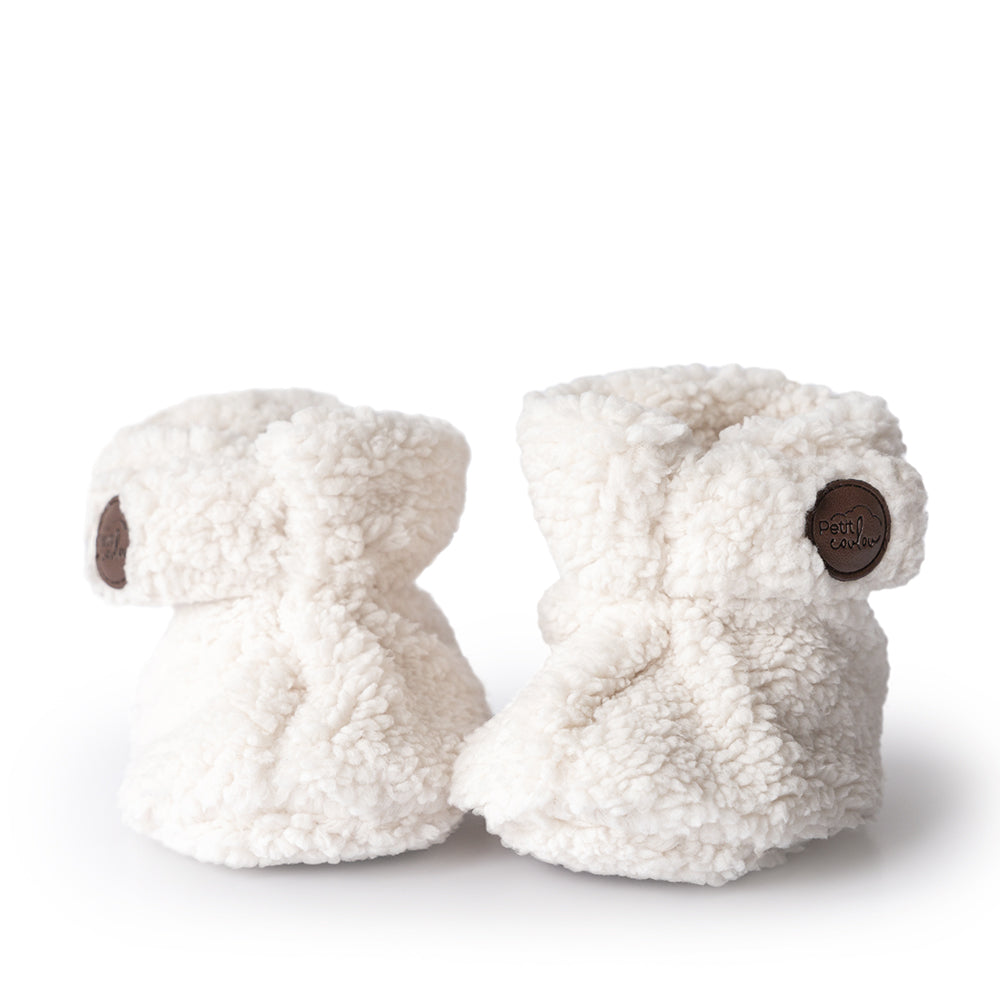 Baby booties in sherpa cream with Petit Coulou logo